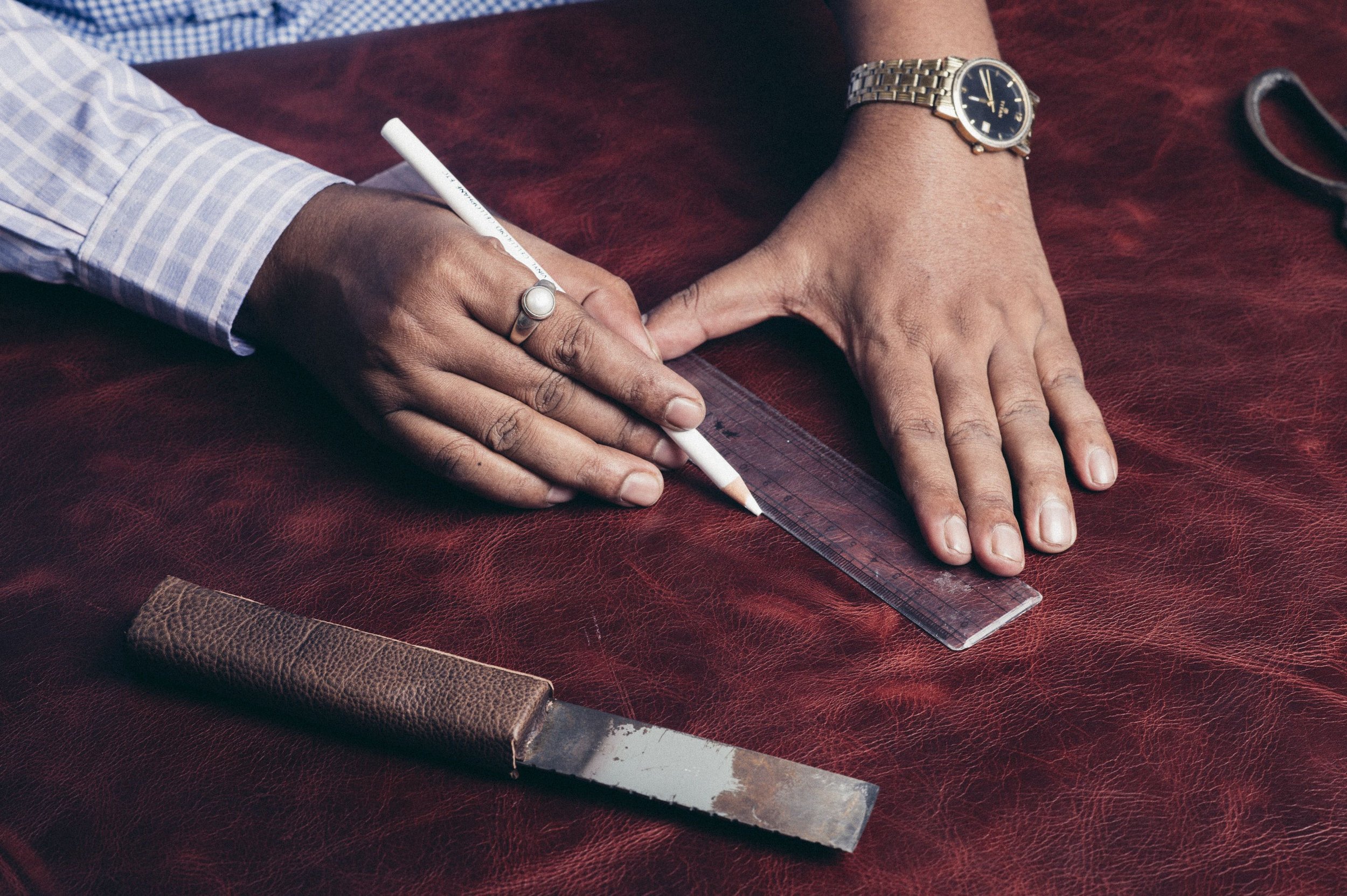 Leather artisan at work at Raja & Mitsu workshop
